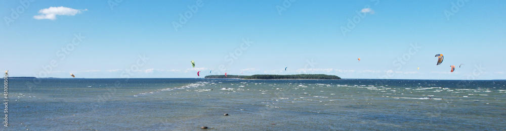 Aerial view of kiteboarding on Baltic Sea. Salmistu beach in Estonia is a popular spot for kite surfing.