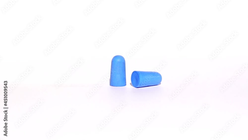 Blue earplugs spinning on a white background Blue earplugs spinning on a white background