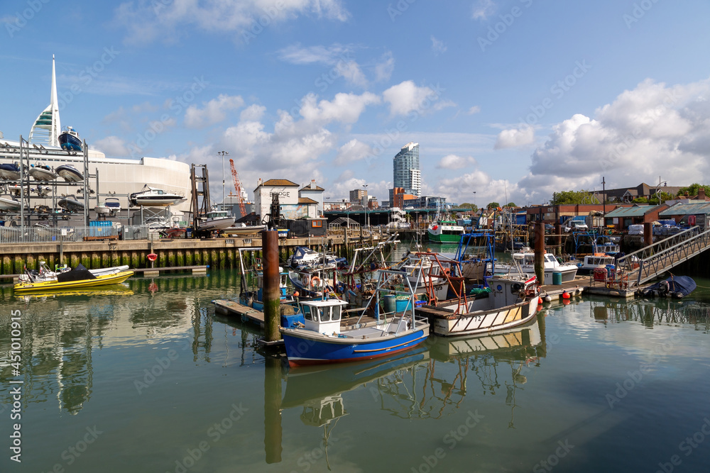 The Camber dock in Old Portsmouth on a calm summers day with fishing bots docked