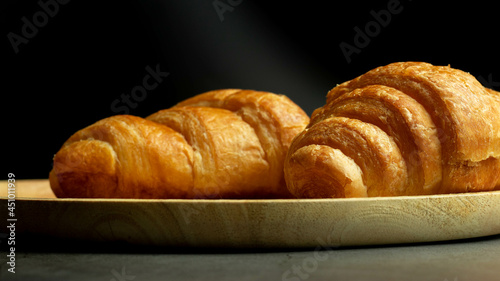This is a picture of a croissant that has been eaten since the past.