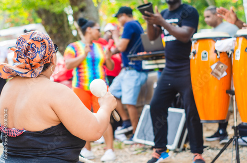 party on the beach with a group of salsan merengue and bachata with instruments photo