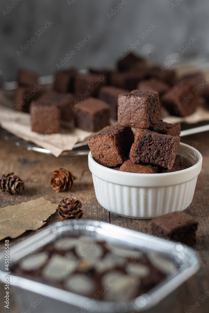 Chocolate brownie cake, dessert with milk on a dark background on a wooden table. Chocolate brownie cake, dessert with milk on a dark background on a wooden table.