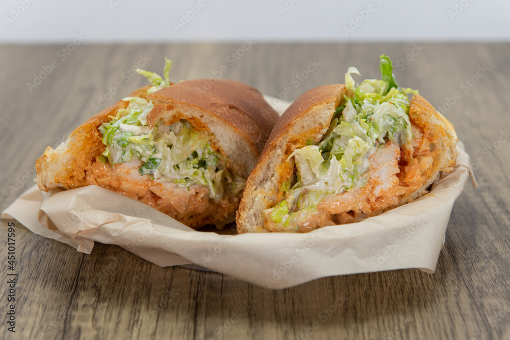 Spicy chicken sandwich loaded with all the good fixings to completely fill any appetite for a meal Spicy chicken sandwich loaded with all the good fixings to completely fill any appetite for a meal