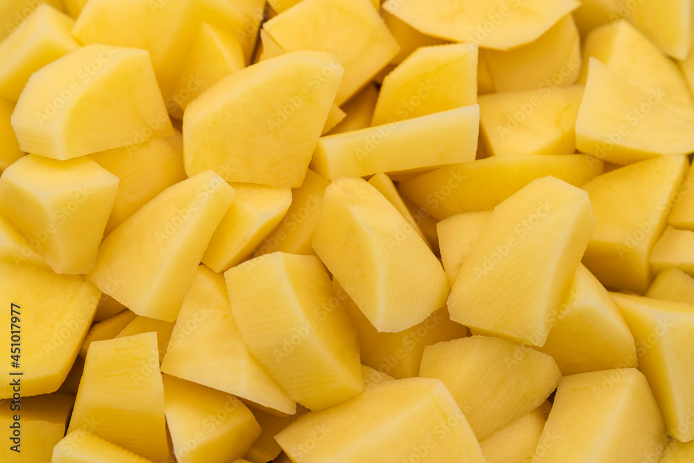 A background of diced raw potatoes A background of diced raw potatoes