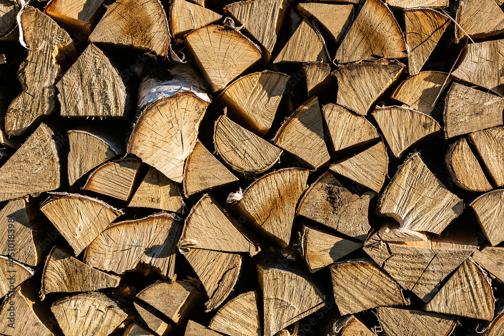 Chopped firewood stacked in a pile Chopped firewood stacked in a pile