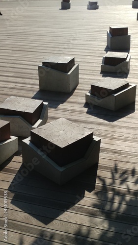 Concrete and wood cubes. Light and shadow.