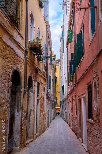 Old narrow streets or calles of Venice  Italy. Medieval atmosphere  shabby and empty alleyways  UNESCO World heritage city.