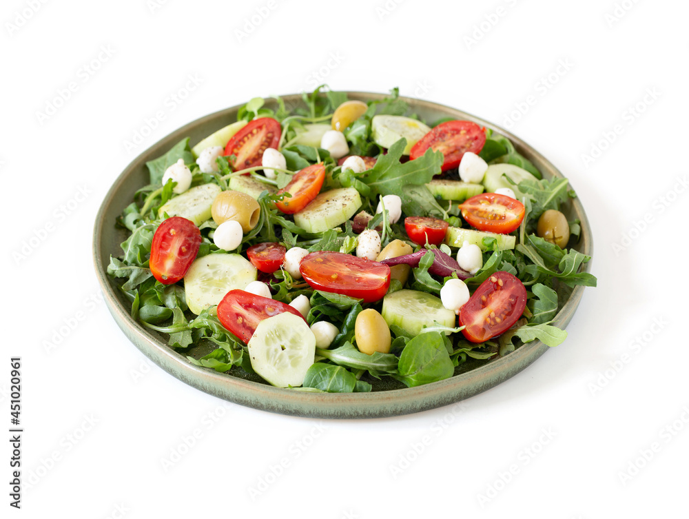 Salad made with arugula, tomatoes, cucumbers, mozzarella and olives