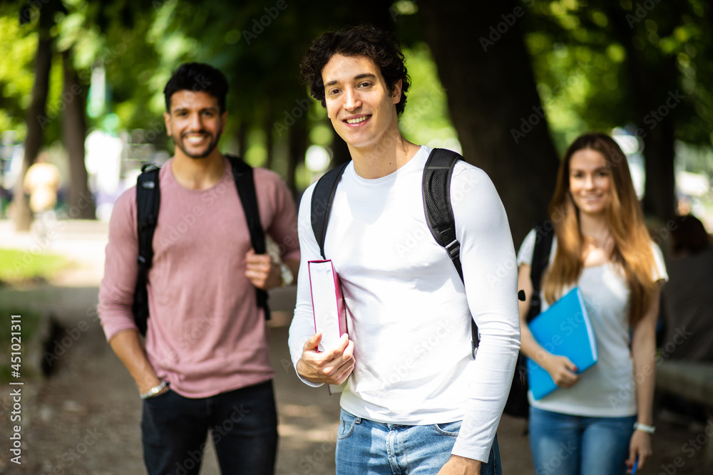 Happy students outdoor smiling confidently
