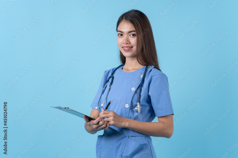 Young woman in nurse uniform smile isolated on light blue background.