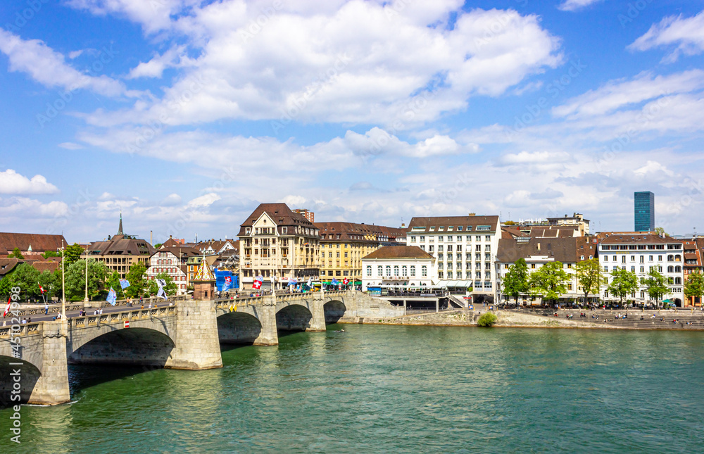 Panoramic view over turquoise Rhine river on a summer day in the centre of Basel, Switzerland