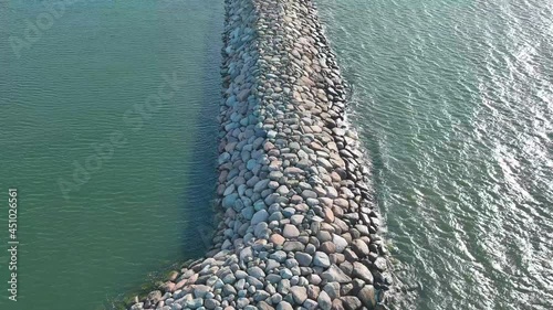 Flying along a stone breakwater at low altitude