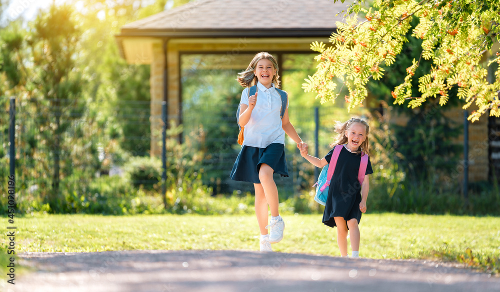 Girls with backpack are going to school Girls with backpack are going to school