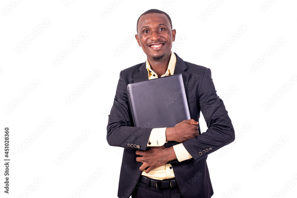 young happy business man holding laptop computer against his che young happy business man holding laptop computer against his che