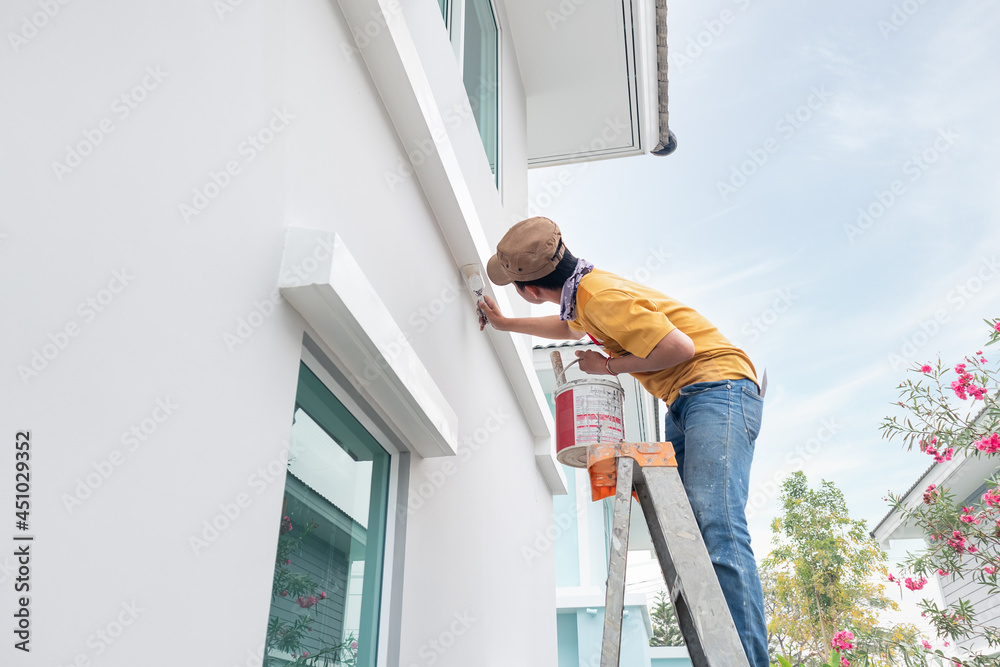 Home or house painting work consist of painter man or worker person and bristles brush, aluminium ladder, bucket to renovation, construction, improvement or repair at crown molding or cornice at wall. - obrazy, fototapety, plakaty 