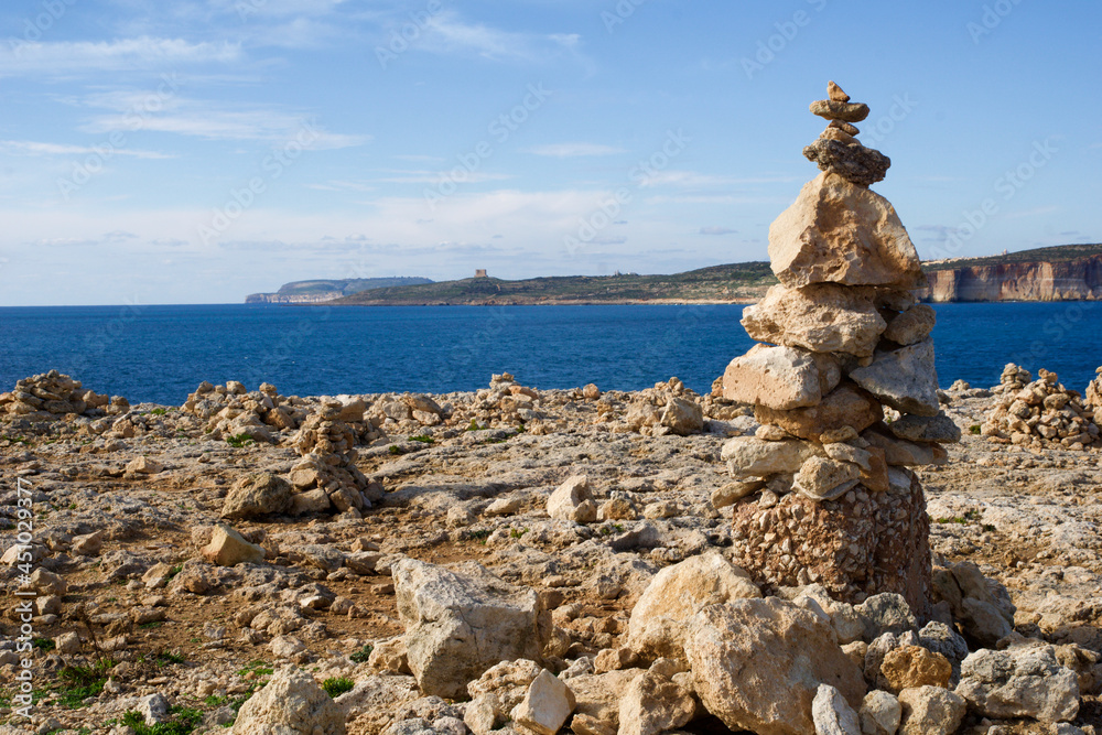 MARSAXLOKK, MALTA - 01 JAN, 2020: Balancing rocks at the seaside, near the former Azure Window on the island of Gozo
