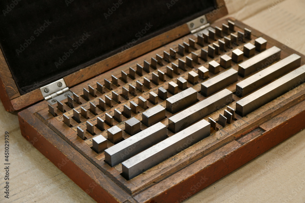 Measuring gauge blocks in industrial production. Measuring gauge blocks in industrial production.