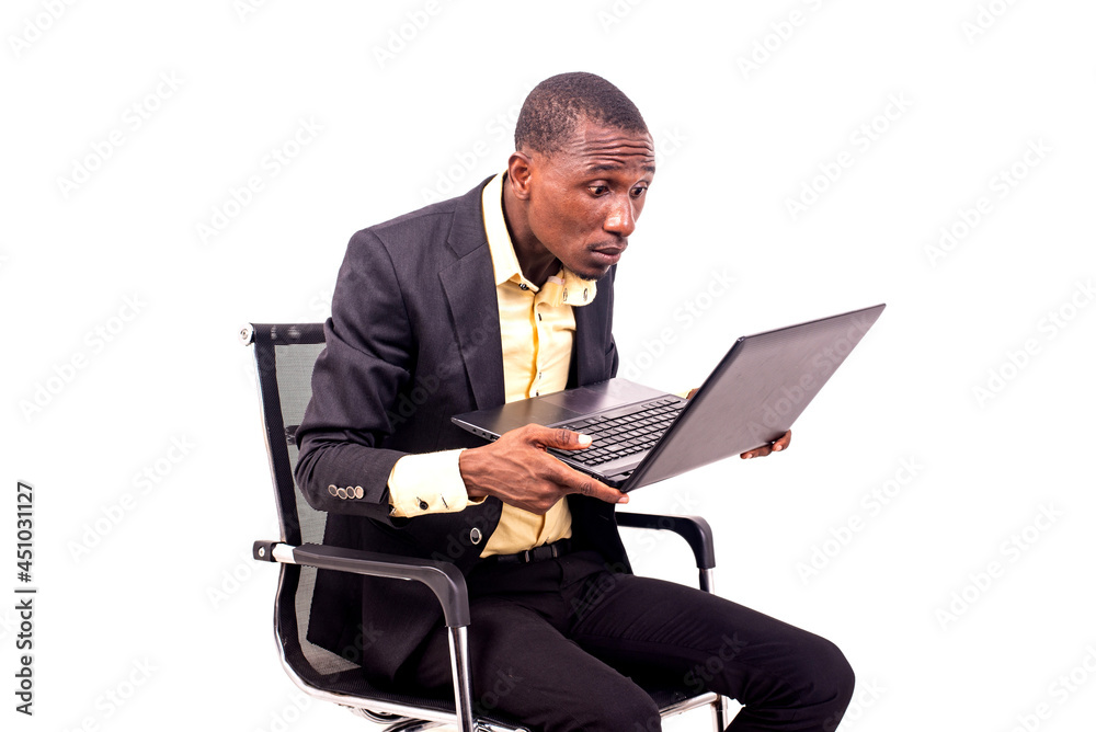 seated businessman brings the laptop close to his eyes to see well. seated businessman brings the laptop close to his eyes to see well.