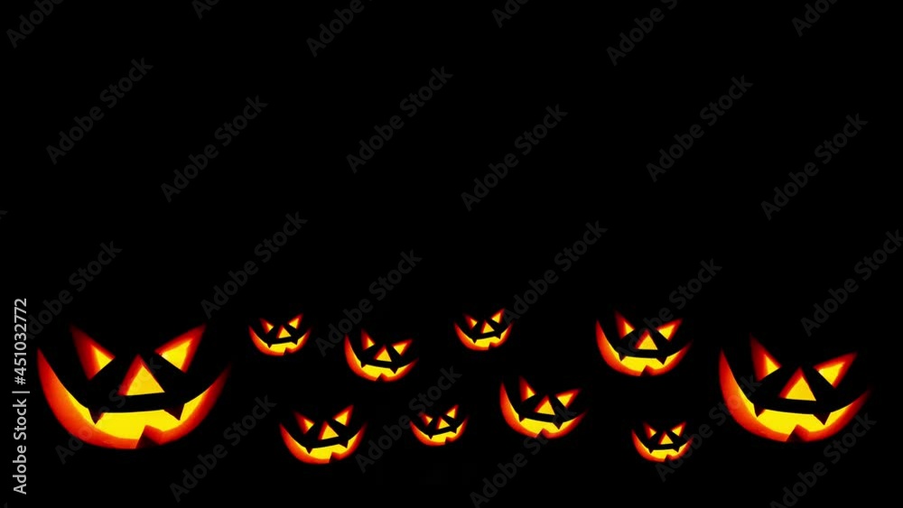 Scary face on blinking on black background. Jack-o-lantern glowing in the dark. Halloween pumpkin Scary face on blinking on black background. Jack-o-lantern glowing in the dark. Halloween pumpkin