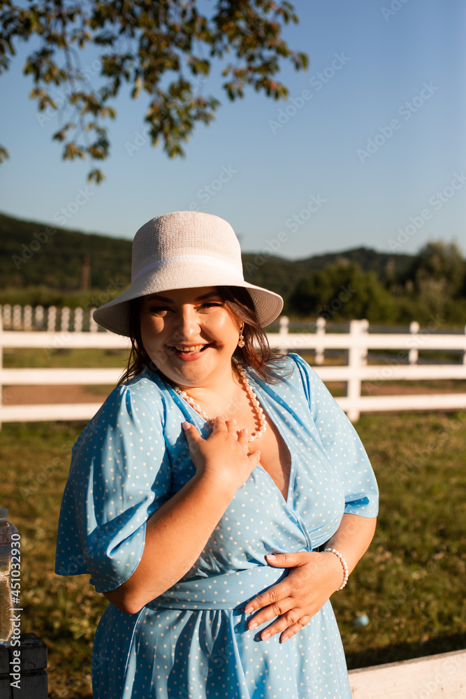 Candid woman in hat at farmland enjoy the summer