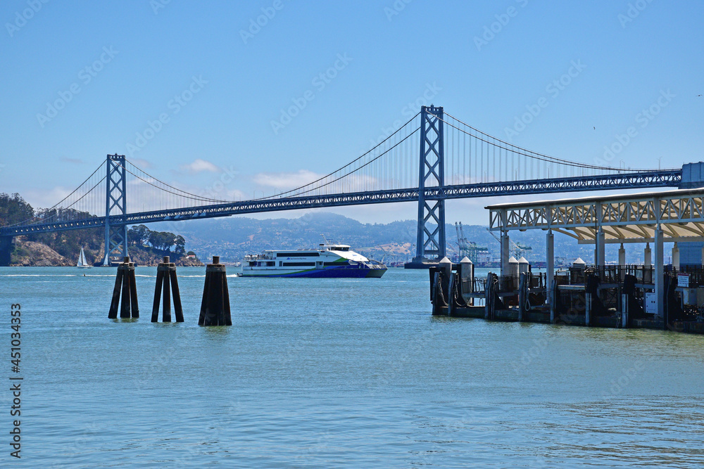 Naklejka premium San Francisco waterfront pier with Bay Bridge seen in background
