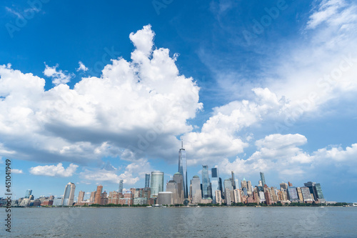 Summer clouds float above the Lower Manhattan skyscraper on June 9 2021 in New York City NY USA.

