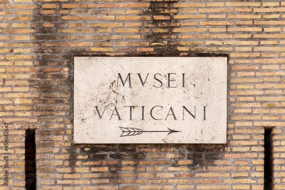 Fototapeta premium Street name Musei Vaticani - Engl: vatican museum - painted at the wall in Rome