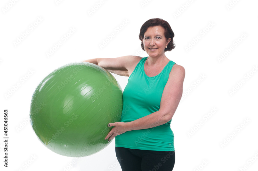 60 year old senior woman doing gymnastics on white background 60 year old senior woman doing gymnastics on white background