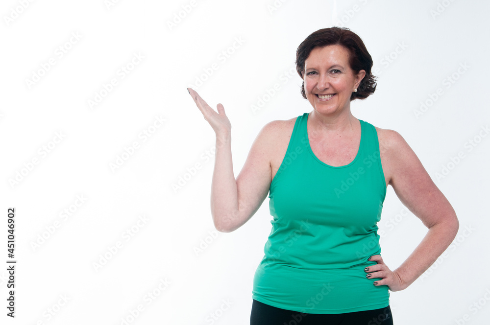 60 year old senior woman doing gymnastics on white background 60 year old senior woman doing gymnastics on white background