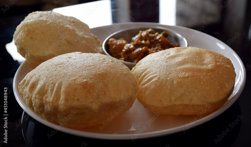 Indian breakfast poori (deep fried bread) at a restaurant