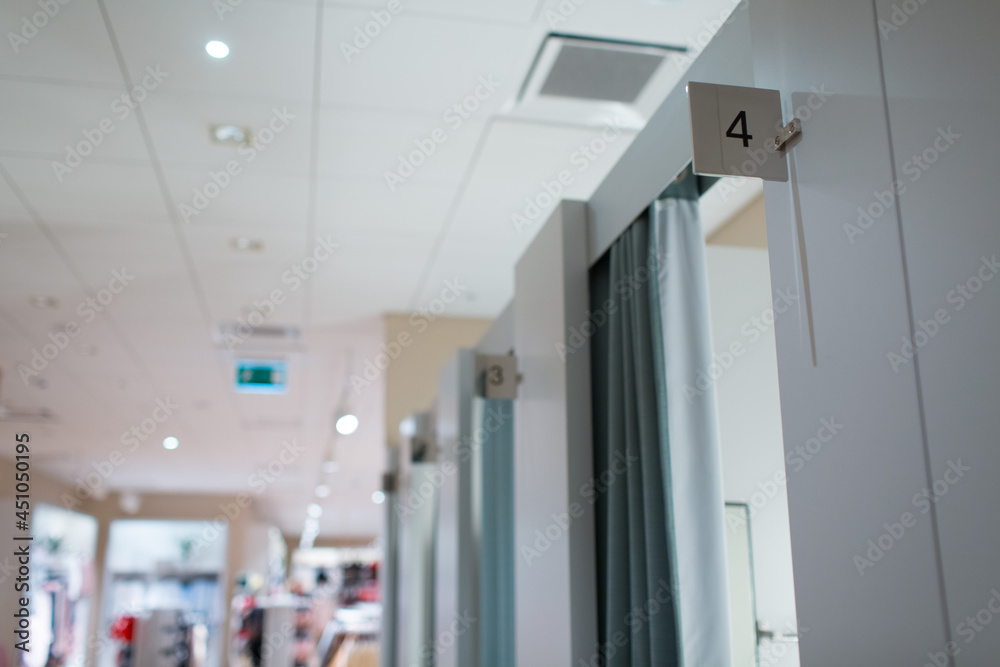 Fitting rooms in the store and number plates Fitting rooms in the store and number plates