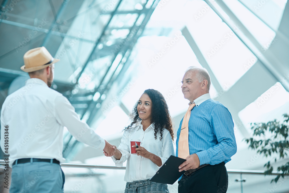 businesswoman meeting her business colleague with a handshake. businesswoman meeting her business colleague with a handshake.