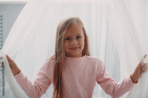 Little girl child in pink clothes portrait at home