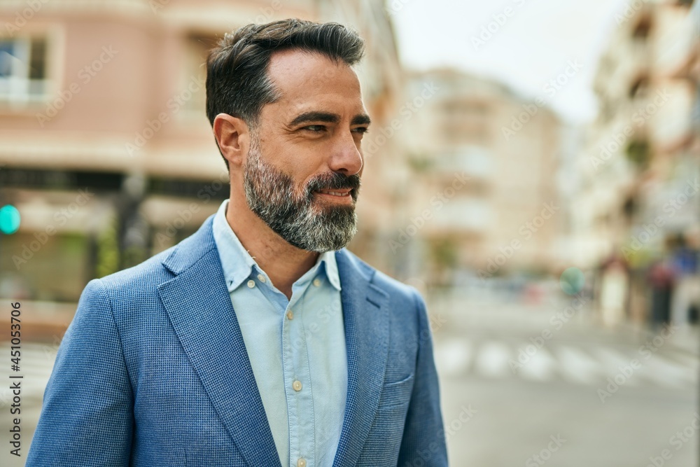 Middle age businessman smiling happy standing at the city. Middle age businessman smiling happy standing at the city.