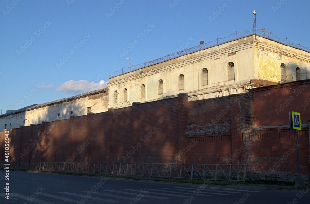 Provincial russian prison. An old prison building with a high fence.