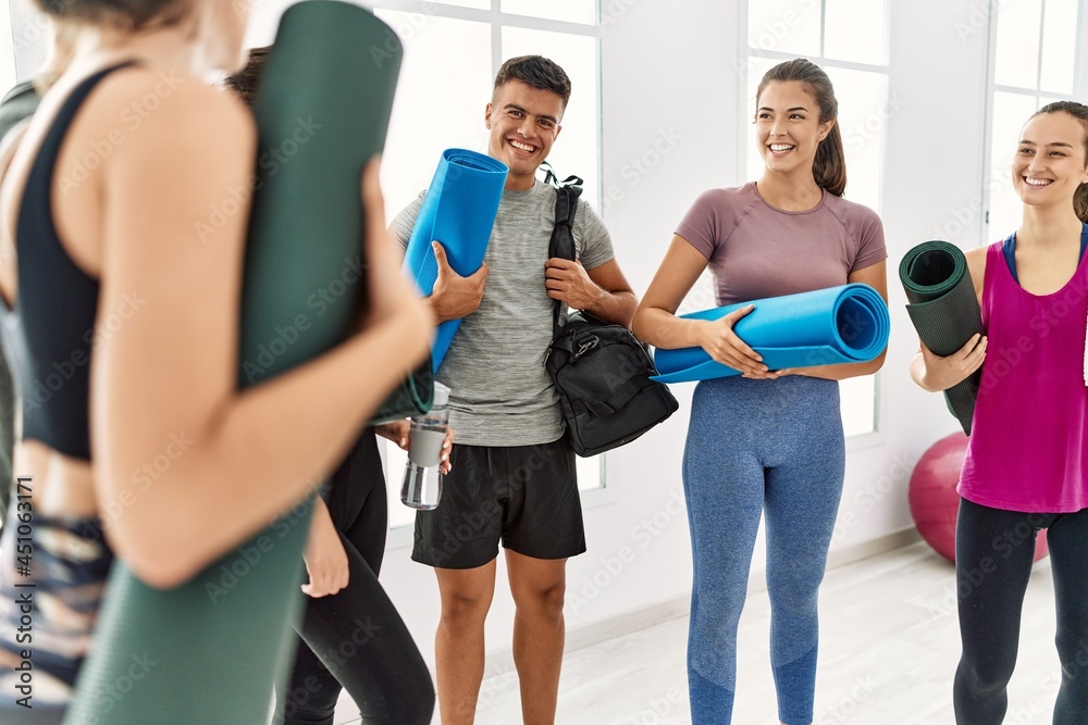 Group of young sporty people smiling happy standing at sport center Group of young sporty people smiling happy standing at sport center