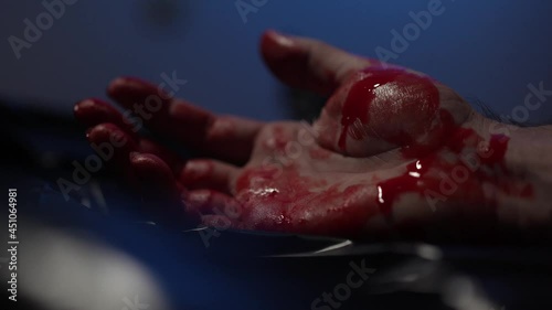 Bloody Hand On The Ground Crime Scene With Police Lights