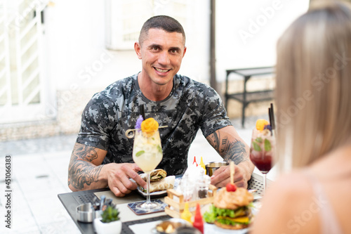 Portrait of Adult Man Eating Tortilla Outdoors Restaurant