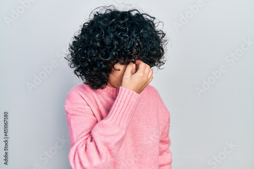 Young middle east woman wearing casual clothes tired rubbing nose and eyes feeling fatigue and headache. stress and frustration concept.