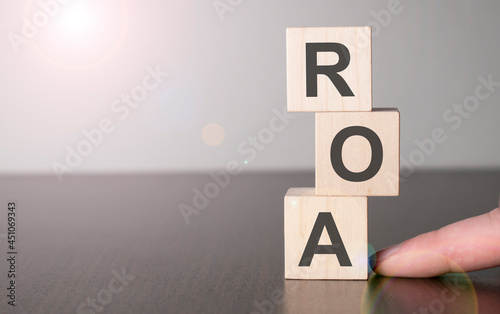 Businesswoman made word roa with wood building blocks. photo