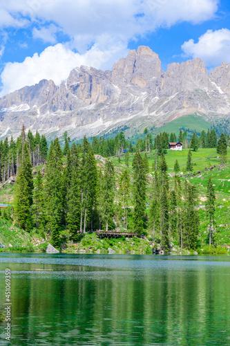 Paradise scenery at Karersee (Lago di Carezza, Carezza lake) in Dolomites of Italy at Mount Latemar, Bolzano province, South tyrol. Blue and crystal water. Travel destination of Europe.