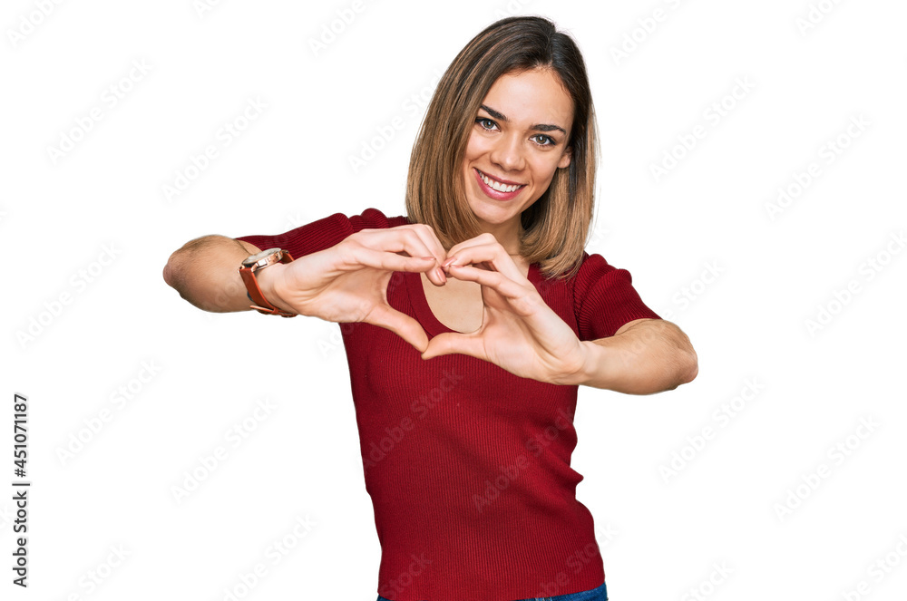 Young blonde girl wearing casual clothes smiling in love doing heart symbol shape with hands. romantic concept. Young blonde girl wearing casual clothes smiling in love doing heart symbol shape with hands. romantic concept.