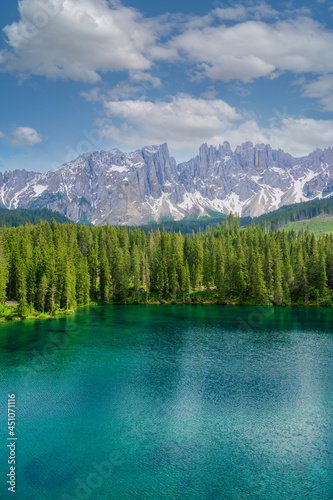 Paradise scenery at Karersee  Lago di Carezza  Carezza lake  in Dolomites of Italy at Mount Latemar  Bolzano province  South tyrol. Blue and crystal water. Travel destination of Europe.
