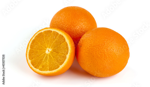 Fresh oranges with half  isolated on white background.