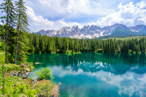 Paradise scenery at Karersee  Lago di Carezza  Carezza lake  in Dolomites of Italy at Mount Latemar  Bolzano province  South tyrol. Blue and crystal water. Travel destination of Europe.