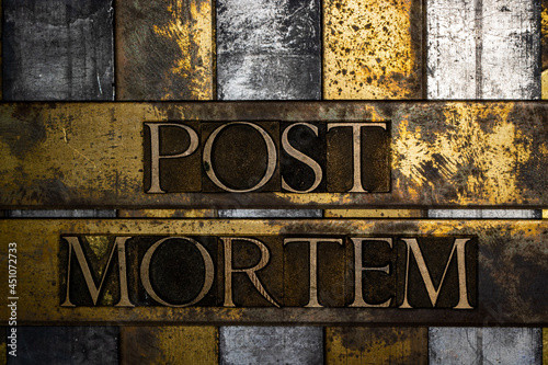 Post Mortem text on vintage textured copper and gold background photo