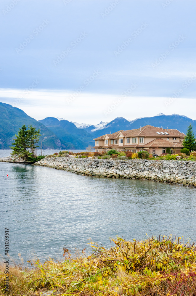 Naklejka premium A perfect neighbourhood. Houses in suburb at Summer in the north America. Luxury houses with nice landscape.