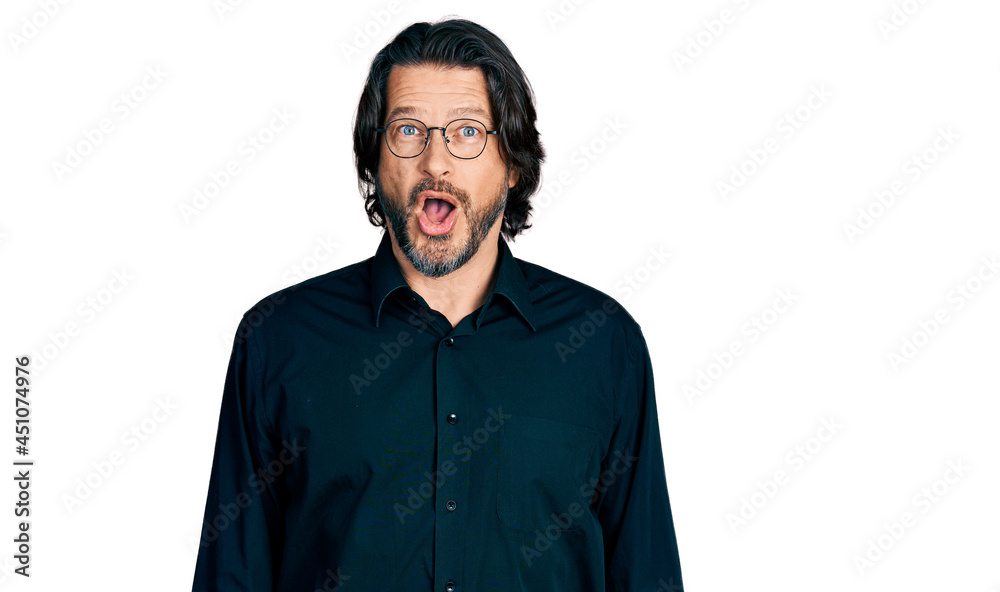 Middle age caucasian man wearing casual clothes and glasses afraid and shocked with surprise expression, fear and excited face. Middle age caucasian man wearing casual clothes and glasses afraid and shocked with surprise expression, fear and excited face.