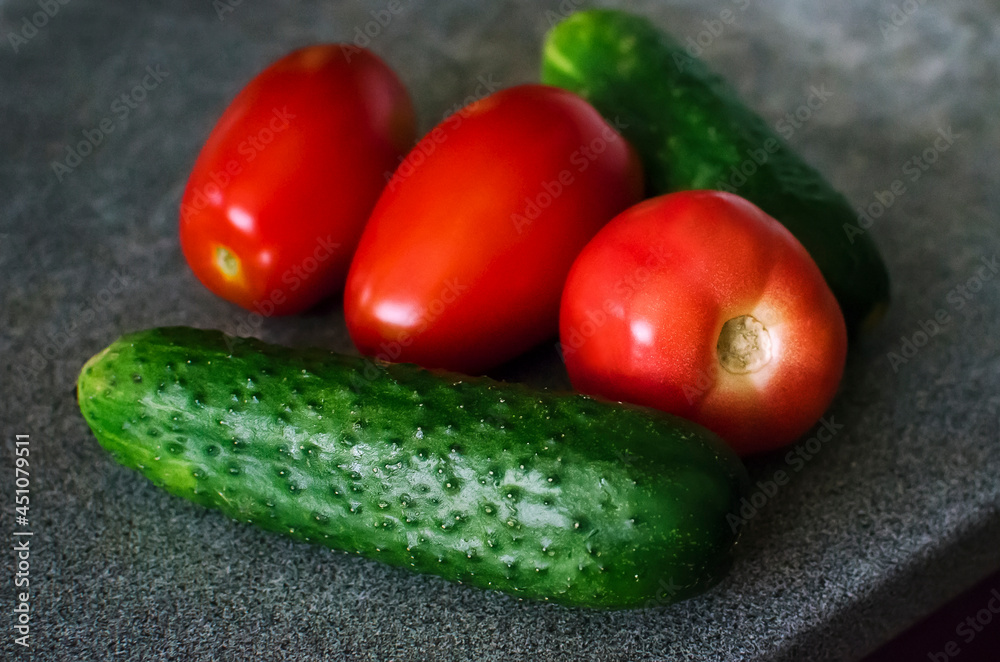 Whole tomatoes and cucumbers. Top view point. Whole tomatoes and cucumbers. Top view point.