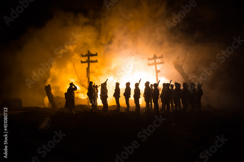 War Concept. Military silhouettes fighting scene on war fog sky background  World War Soldiers Silhouette Below Cloudy Skyline At night. Battle in ruined city.